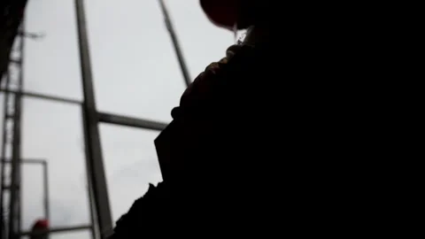 Silhouette of construction worker laying brick at building site Stock Footage 315957056