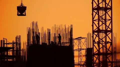Silhouette of Construction workers are working on the construction site Stock Footage 138991691