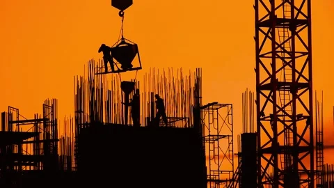 Silhouette of construction workers at sunset, Stock Footage