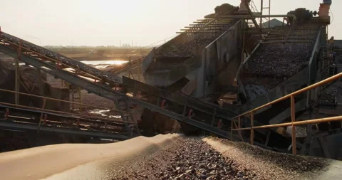 Silhouette of conveyor system in the quarry of sand and gravel. Screening and Stock Footage 292302319