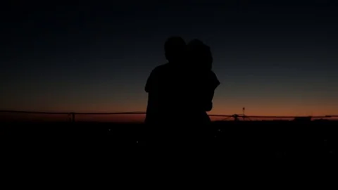 Silhouette couple dancing at sunset Stock Footage 73781668