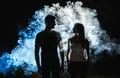 The silhouette of couple in the smoke Photo