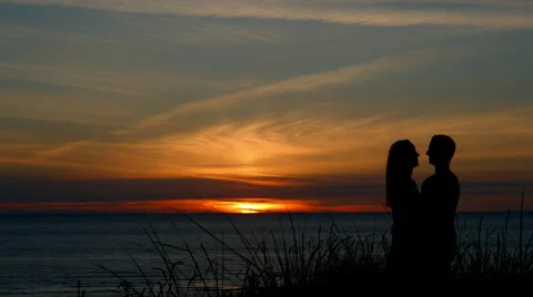 Silhouette of couple at sunset Stock Footage 66390234