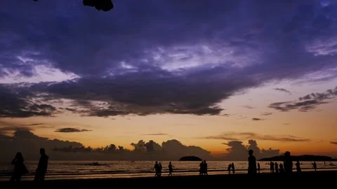 Silhouette of a couple walking on the beach Stock Footage 300695089