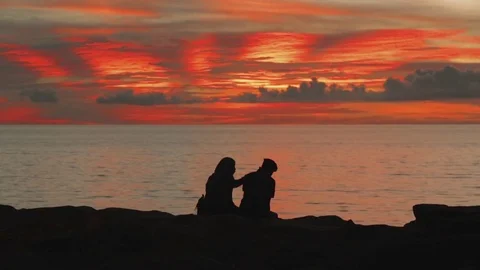 Silhouette of couples at the beach Video stock 81353898