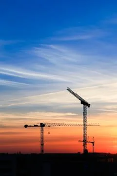 Silhouette of crane construction Stock Photos