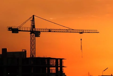 Silhouette Crane on Sunset Background Stock Photos