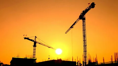 Silhouette crane working in construction site and sunset Stock Footage 48661003
