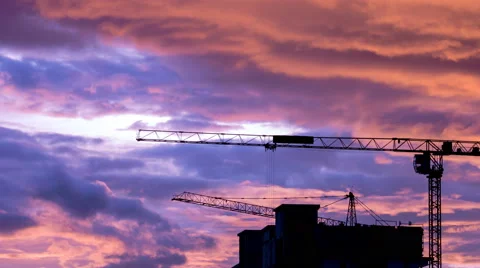 Silhouette Crane Working In Construction Site And Twilight Sky (pan shot) Stock Footage 51941561