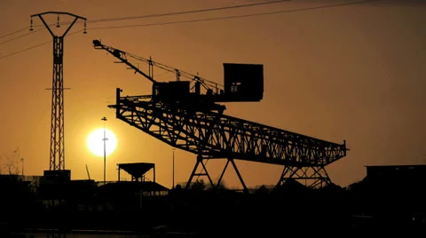 Silhouette. cranes industry logistics. time lapse at sunset Stock Footage 33803534