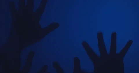 Silhouette of Creepy human hands moving on glass window Stock Footage