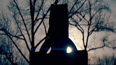 Silhouette of Cross Gravestone with Dead Trees in Winter Stock Footage 129102834