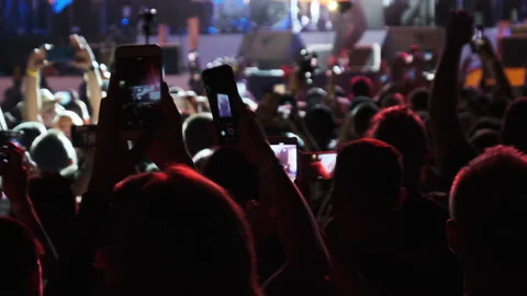 Silhouette of Crowd Making Video with Smartphone at Live Rock Concert. Slow Stock Footage 139527686