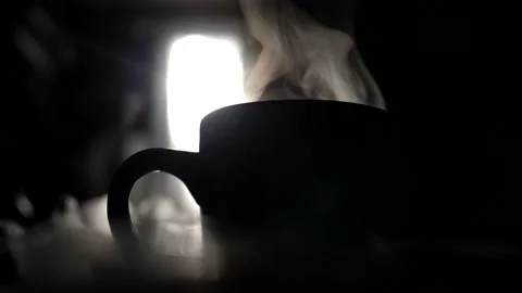 Silhouette cup of tea, into which boiled hot water is poured from the kettle Stock Footage 235072571