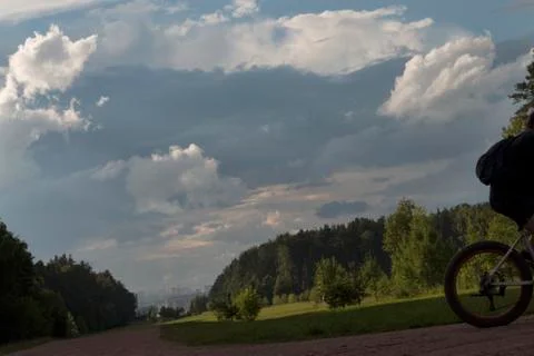 Silhouette of the cyclist with backpack Stock Photos