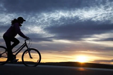 Silhouette of cyclist Stock Photos