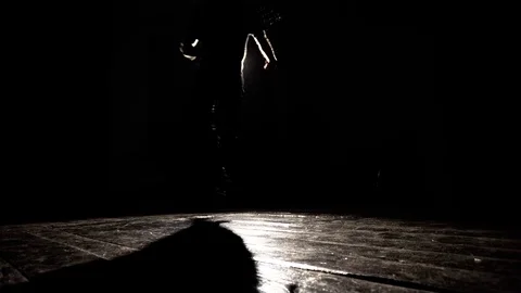 Silhouette of dancer breaking guy in a studio against a lantern background Stock Footage 82585311