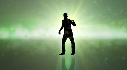 Silhouette dancer on green struts his stuff on a colorful background Stock Footage 33875491