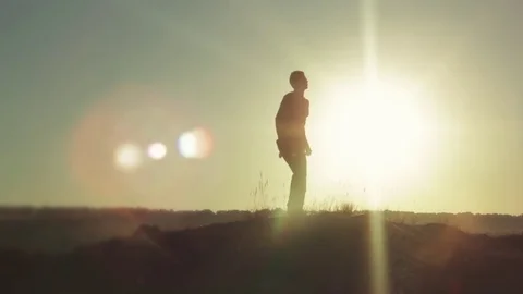 Silhouette of a dancing man at sunset Stock Footage 78154325