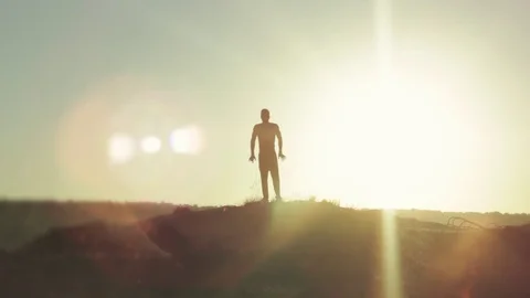 Silhouette of a dancing man at sunset Stock Footage 78154332