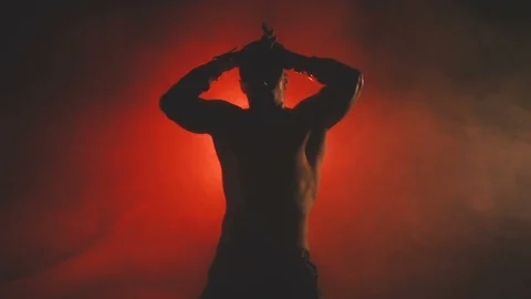 Silhouette of a dancing sexy man Stock Footage 103157943