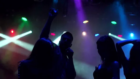 Silhouette of dancing young people in the dark. Stock Footage 86162159