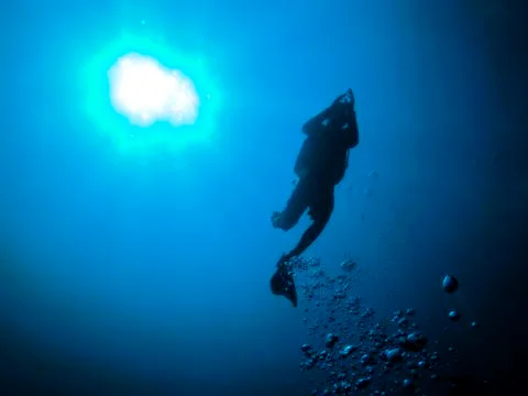 Silhouette diver Stock Photos