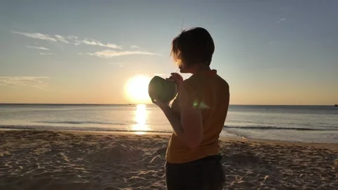 Silhouette with Drink at Sunset Bliss Stock Footage 259687569