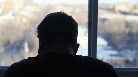 Silhouette of drunk middle-aged man feeling depressed and drinking a glass Stock Footage 106362582
