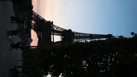 Silhouette of Eiffel Tower in Paris at Sunset, Vertical Reveal Stock Footage 246729310