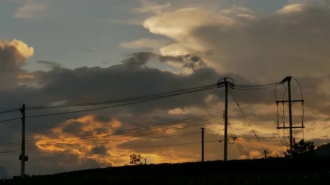 Silhouette of electric pole with beautiful cloud and sunset background Stock Footage 81383977