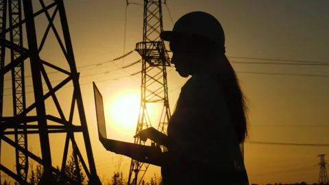 Silhouette electrical engineer, work laptop sunset, electric tower, engineering Stock Footage 244680968