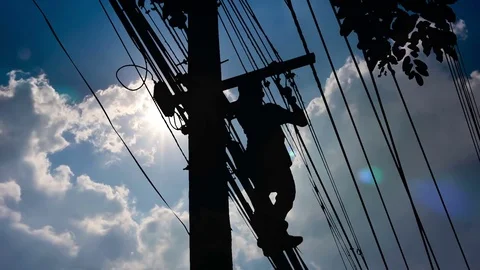 Silhouette Electrician wiring Newly on Pole Stock Footage