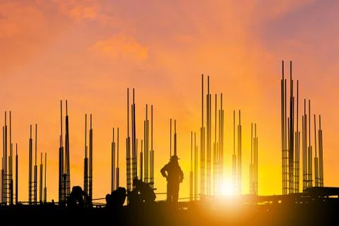 Silhouette of Engineer and worker on building construction site clipping path Fotos de archivo