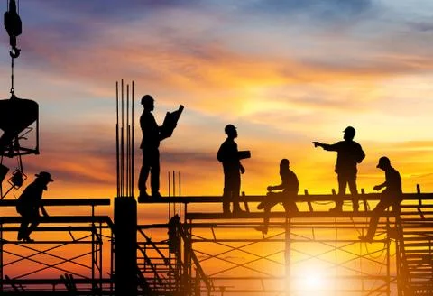 Silhouette of Engineer and worker on building site, construction site sunset Fotos Stock