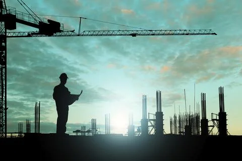 Silhouette engineer reading a building plan while working on construction sit Stock Photos