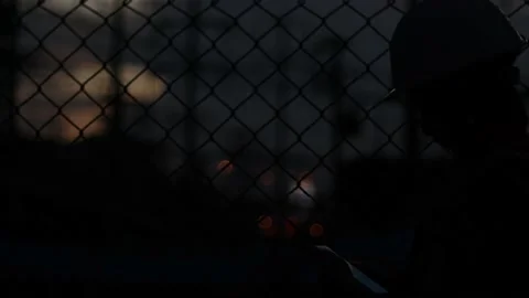 Silhouette engineer standing orders for construction crews and using phone. Stock Footage 165434054