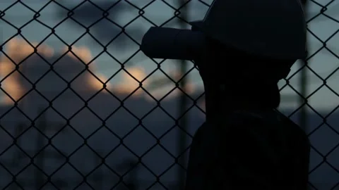 Silhouette engineer standing orders for construction crews and using phone. Stock Footage 165434238
