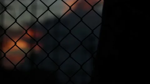 Silhouette engineer standing orders for construction crews and using phone. Stock Footage 165434242