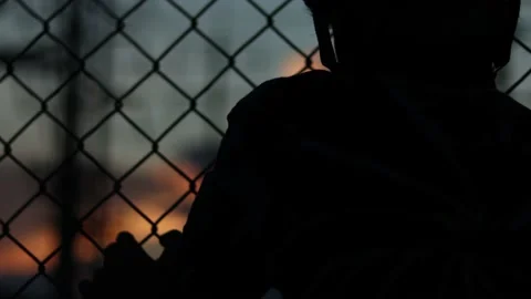 Silhouette engineer standing orders for construction crews and using phone. Stock Footage 165434286
