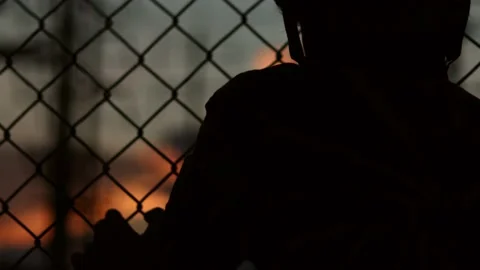 Silhouette engineer standing orders for construction crews and using phone. Stock Footage 165434383