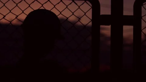 Silhouette engineer standing orders for construction crews and using phone. Stock Footage 165434578