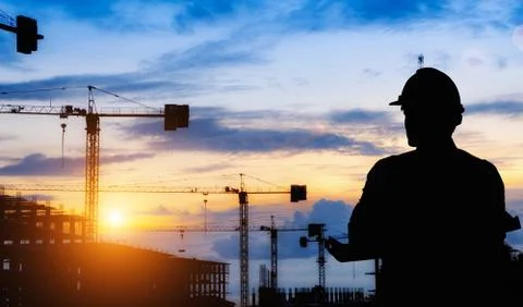 Silhouette engineer standing work on construction. Stock Photos