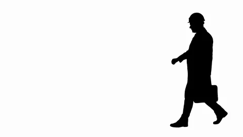 Silhouette Engineer walking in a rush and looking at his watch. Vídeos de archivo 109072952