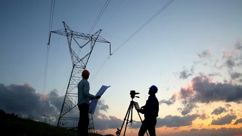 Silhouette of Engineers at Work: Electricity Station Stockbeeldmateriaal 276285852