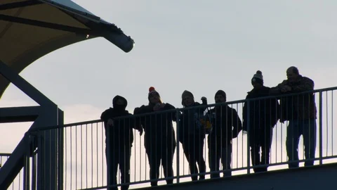 Silhouette of fans standing in the upper section of the stadium Stock Footage 102109463