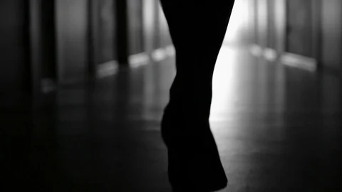 Silhouette of Female Legs in High Heels Walking Stock Footage