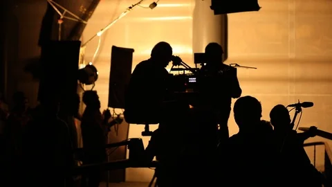Silhouette of Film crew at work place Stock Footage 115412330
