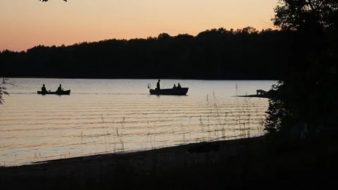 Silhouette of fish boats docking at shore Stock-Footage 134851069