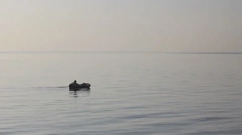Silhouette of a floating boat at sunset 스톡 동영상 55336588